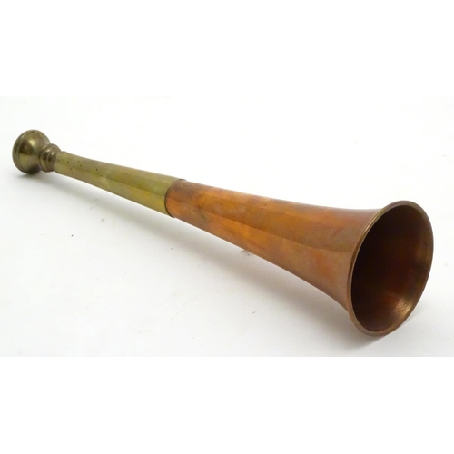 303 - A copper and brass short hunting horn. 8 1/2'' long