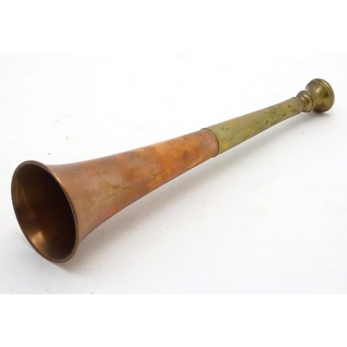 303 - A copper and brass short hunting horn. 8 1/2'' long