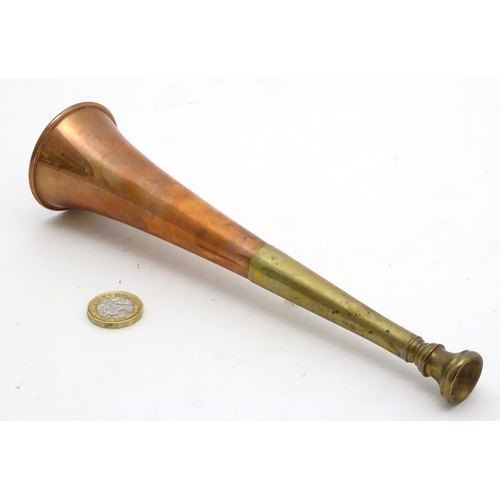 303 - A copper and brass short hunting horn. 8 1/2'' long