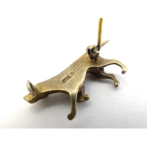 316 - A silver gilt brooch formed as a dog 1 1/4'' long