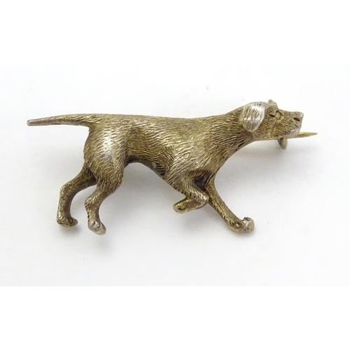 316 - A silver gilt brooch formed as a dog 1 1/4'' long