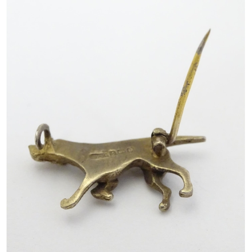 316 - A silver gilt brooch formed as a dog 1 1/4'' long