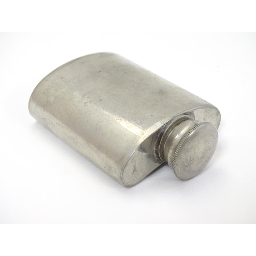 320 - A small hip flask with screw top 2 3/4'' high