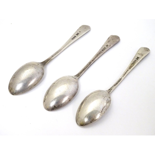 321 - A set of 3 silver teaspoon with crossed golf club and ball to handles. Hallmarked Sheffield 1933 mak... 