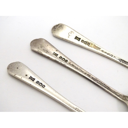 321 - A set of 3 silver teaspoon with crossed golf club and ball to handles. Hallmarked Sheffield 1933 mak... 