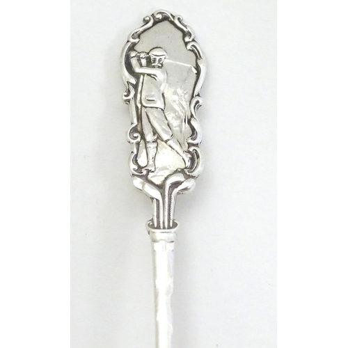 322 - Golf Interest : A silver teaspoon with decoration to handle depicting a golfer. Hallmarked 1912 make... 