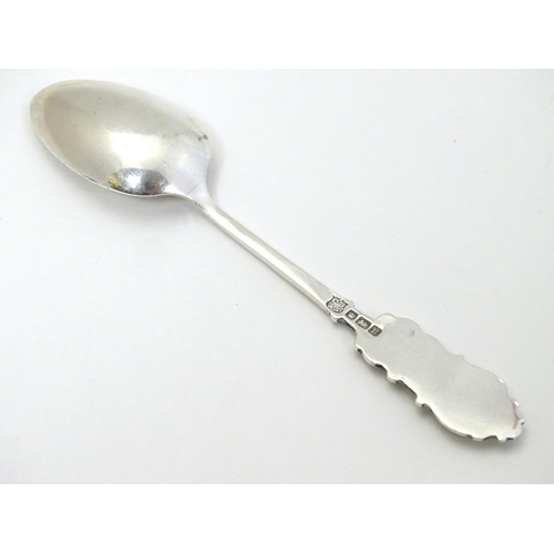 322 - Golf Interest : A silver teaspoon with decoration to handle depicting a golfer. Hallmarked 1912 make... 