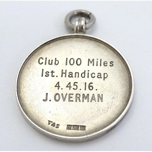 331 - Cycling Interest: A silver fob with enamel decoration for 'Comet Cycling Club ' and engraved ' Club ... 