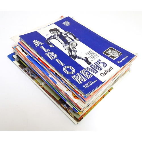 37 - Football Programmes: A quantity of 'away' football programmes all featuring Oxford United, playing a... 