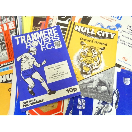 37 - Football Programmes: A quantity of 'away' football programmes all featuring Oxford United, playing a... 