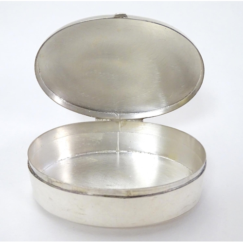 381 - A silver box of oval form, hallmarked Birmingham 2006, maker Ari D. Norman, having applied cabochon ... 