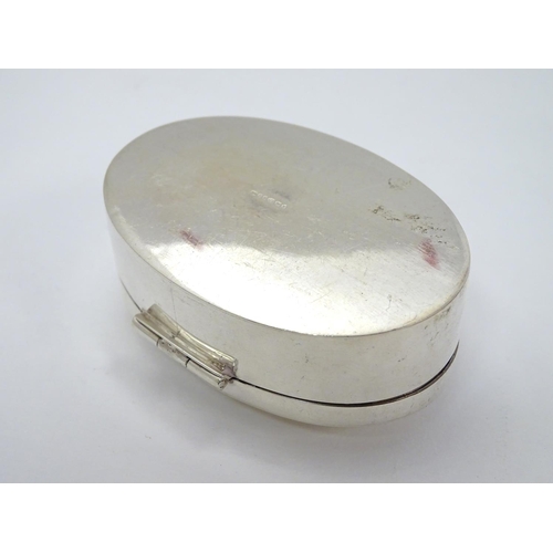 381 - A silver box of oval form, hallmarked Birmingham 2006, maker Ari D. Norman, having applied cabochon ... 