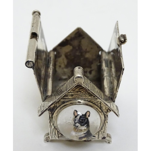 384 - A novelty silver vesta case formed as a dog kennel / dog house  with sprung action to roof, striker ... 