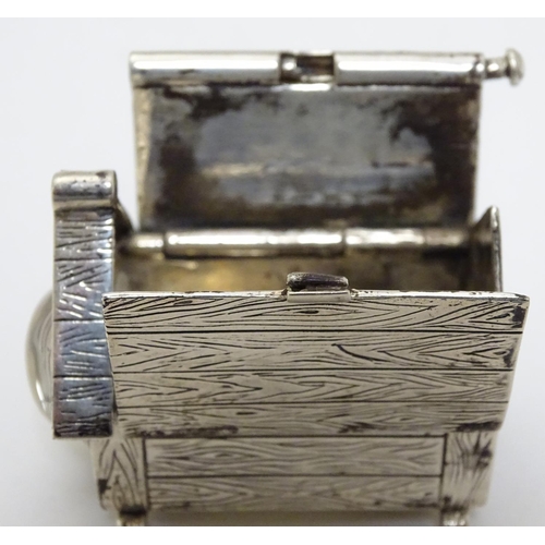 384 - A novelty silver vesta case formed as a dog kennel / dog house  with sprung action to roof, striker ... 