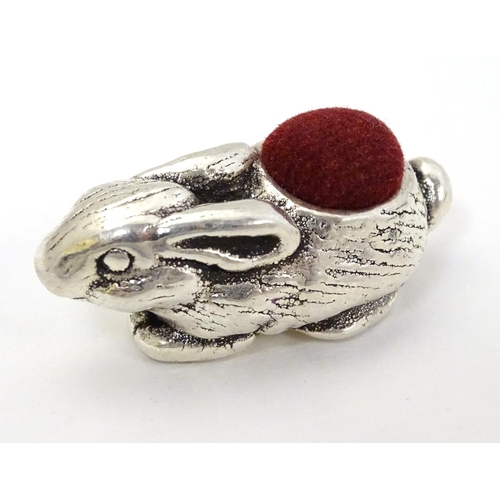 391 - A Novelty silver pin cushion formed as rabbit . Marked '925' . 1 1/2'' long