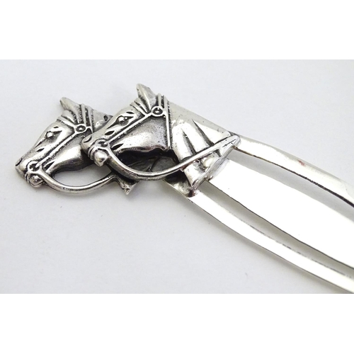 393 - A .925 silver bookmark surmounted by horse head decoration. 3 1/2'' long