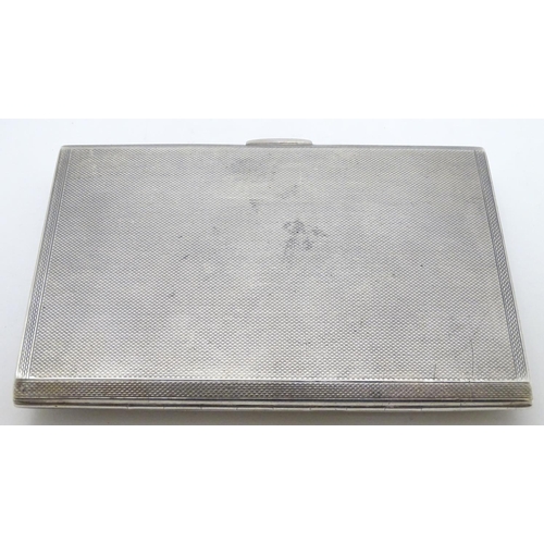 404 - A silver cigarette case hallmarked Birmingham 1939 with later applied ceramic cabochon to front depi... 