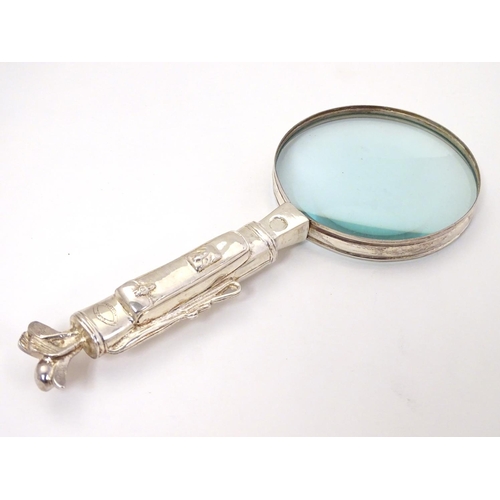 408 - A magnifying glass with handle formed as a golf bag and clubs 9 1/2'' long