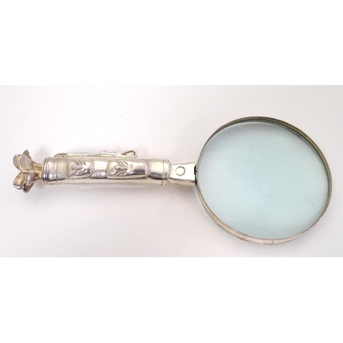 408 - A magnifying glass with handle formed as a golf bag and clubs 9 1/2'' long