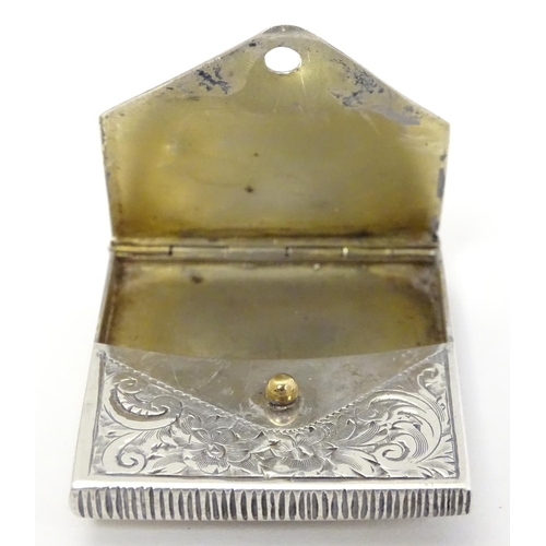 414 - A white metal vesta case of envelope form, with striker under, and having later applied ceramic cabo... 