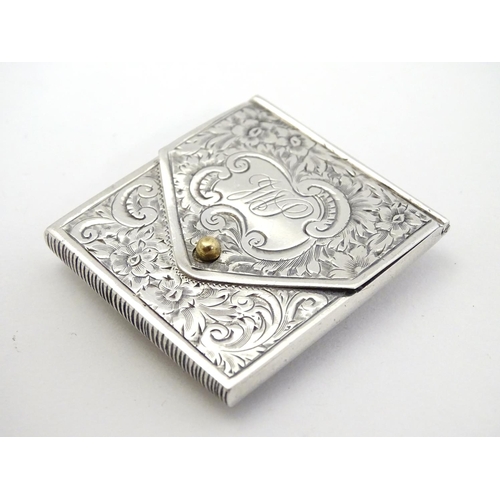 414 - A white metal vesta case of envelope form, with striker under, and having later applied ceramic cabo... 