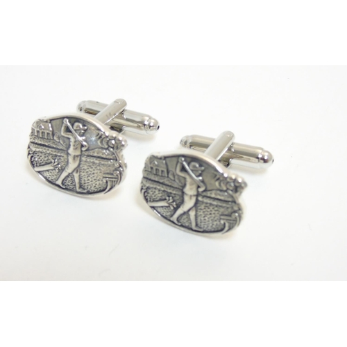 446 - A pair of cufflinks with golf scene decoration