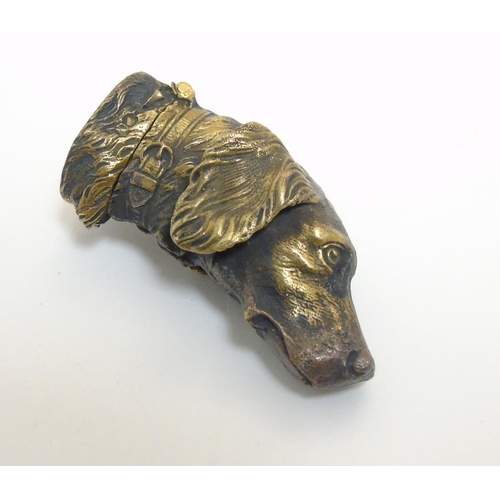 451 - A brass vesta case formed as the head of a dog. Approx 2 1/4'' long