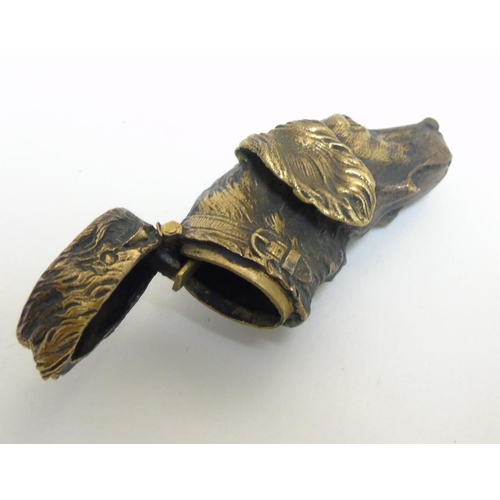 451 - A brass vesta case formed as the head of a dog. Approx 2 1/4'' long