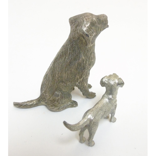 455 - A cast silver plate model of a dog standing together with another, formed as a seated dog. The  larg... 