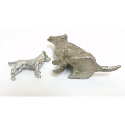 455 - A cast silver plate model of a dog standing together with another, formed as a seated dog. The  larg... 