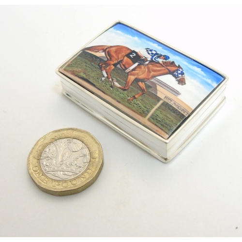 457 - A pill box with enamel decoration to lid, depicting racehorse and jockey. Approx 1 3/4'' x 1 1/4'' x... 