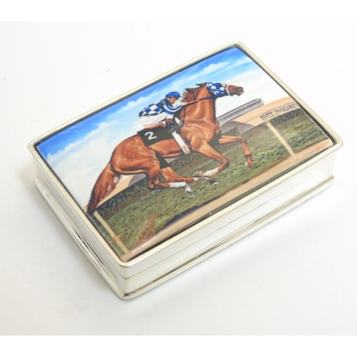 457 - A pill box with enamel decoration to lid, depicting racehorse and jockey. Approx 1 3/4'' x 1 1/4'' x... 