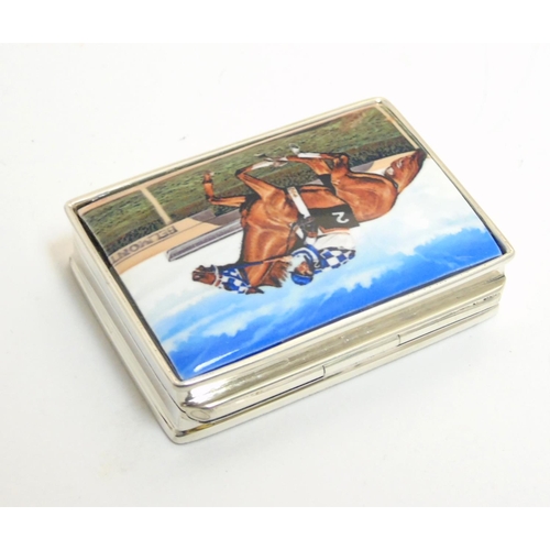 457 - A pill box with enamel decoration to lid, depicting racehorse and jockey. Approx 1 3/4'' x 1 1/4'' x... 