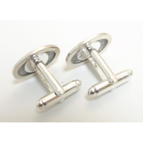 464 - A pair of cufflinks with jockey decoration