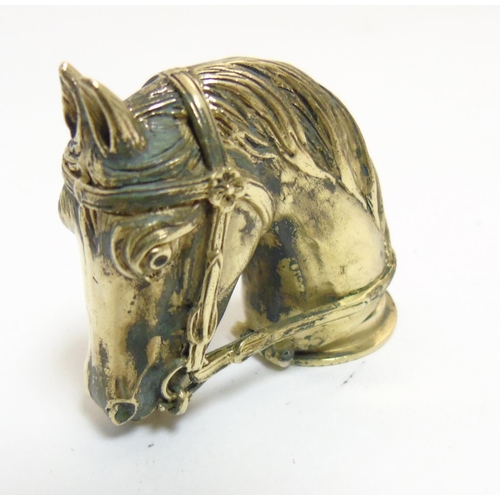 469 - A brass vesta cased formed as a horses head. Approx 2'' long