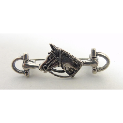 471 - A brooch formed as a horses bit with horse head decoration to centre, approximately 1 1/2'' wide