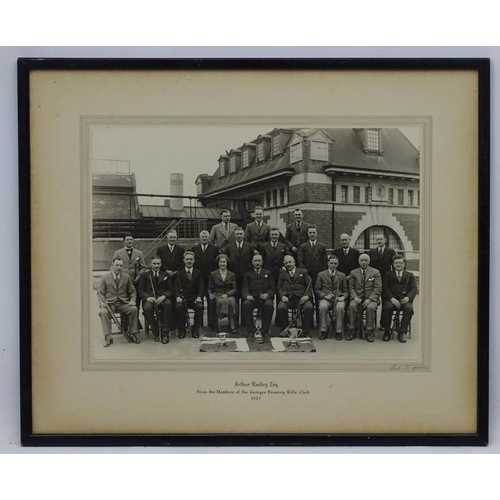 478 - Shooting : A monochrome photograph depicting members of the Georges Brewery Rifle Club , dated 1937 ... 