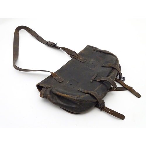 500 - Shooting: A small, vintage leather game/cartridge/range bag with shoulder strap and fastened by thre... 