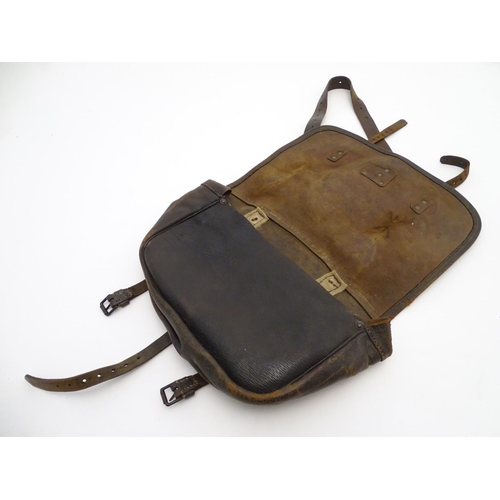 500 - Shooting: A small, vintage leather game/cartridge/range bag with shoulder strap and fastened by thre... 