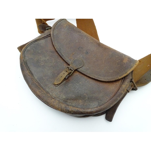 501 - Shooting: A vintage leather Payne Gallwey-type cartridge bag, with canvas shoulder strap and provisi... 