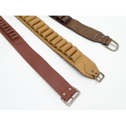 503 - Shooting: A vintage brown leather 12 bore cartridge belt, with brass buckle and open-loop provision ... 