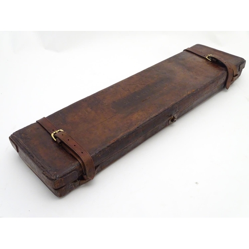 505 - Shooting: A vintage leather gun motor case, with bramah lock, dual straps and carrying handle, the i... 