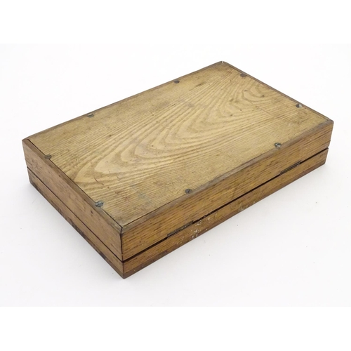 509 - Shooting: A 19thC travelling pistol case, of oak construction, the interior with blue baize lining, ... 