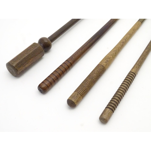 511 - Shooting: A collection of four antique shotgun cleaning rods, comprising a one-piece beech example w... 