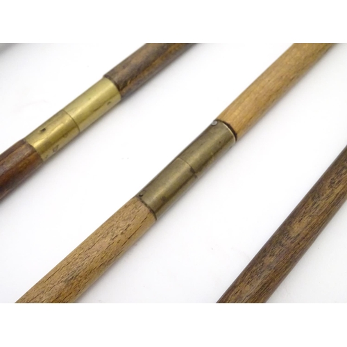 511 - Shooting: A collection of four antique shotgun cleaning rods, comprising a one-piece beech example w... 