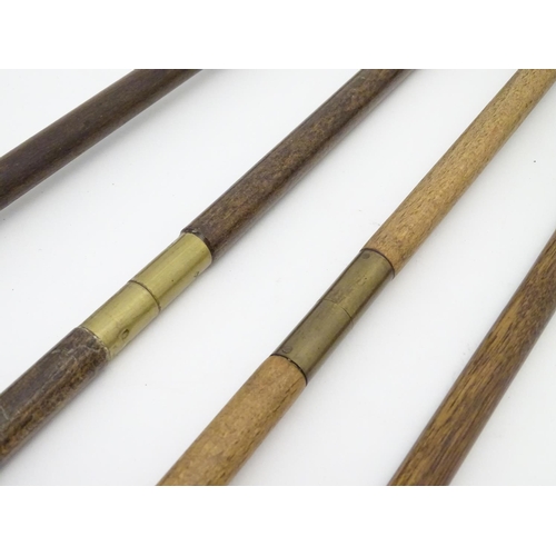 511 - Shooting: A collection of four antique shotgun cleaning rods, comprising a one-piece beech example w... 