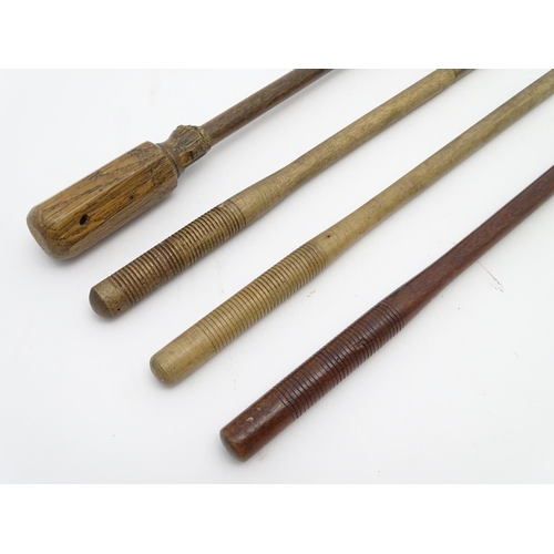 512 - Shooting: A collection of four antique shotgun cleaning rods, comprising a one-piece beech example w... 