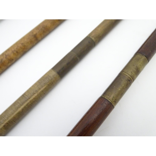 512 - Shooting: A collection of four antique shotgun cleaning rods, comprising a one-piece beech example w... 