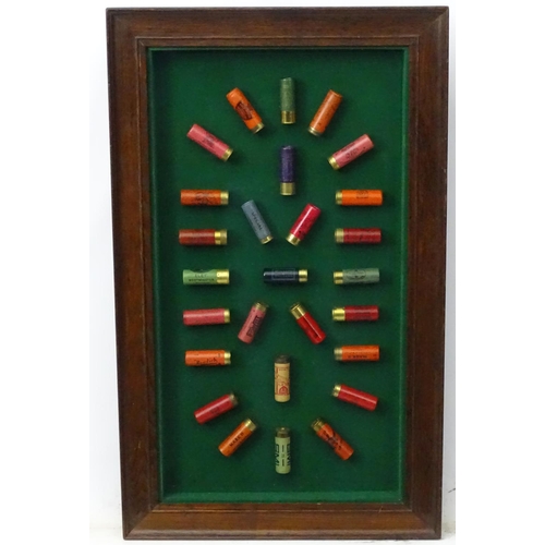 526 - Cartridge display board: A 20thC shotgun cartridge display case, the baize lined shadow box with oak... 