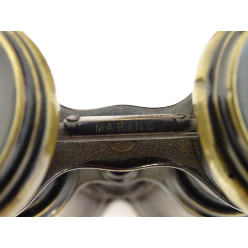 529 - A cased pair of WWI-era French multi-use binoculars, of brass construction with black finish and lea... 